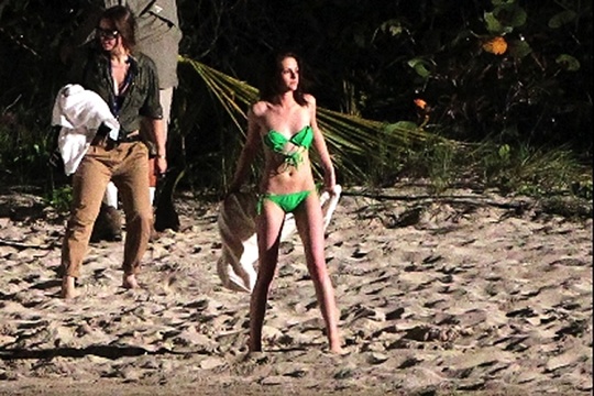 Brooding star Kristen Stewart was photographed wearing a bright green bikini