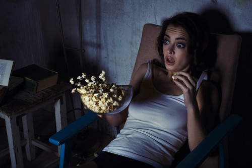 woman, scared horror movie, popcorn drops woman, scared horror movie, popcorn drops